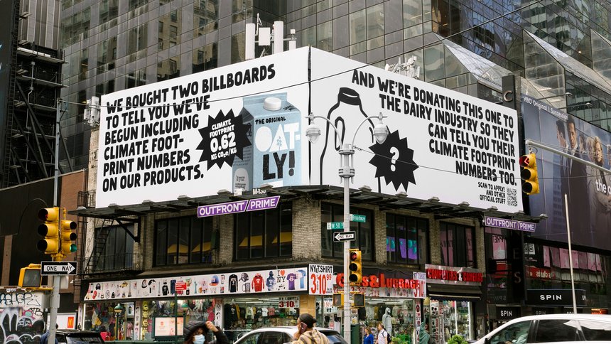 An Oatly billboard drawing attention to the environmental impact of dairy milk.