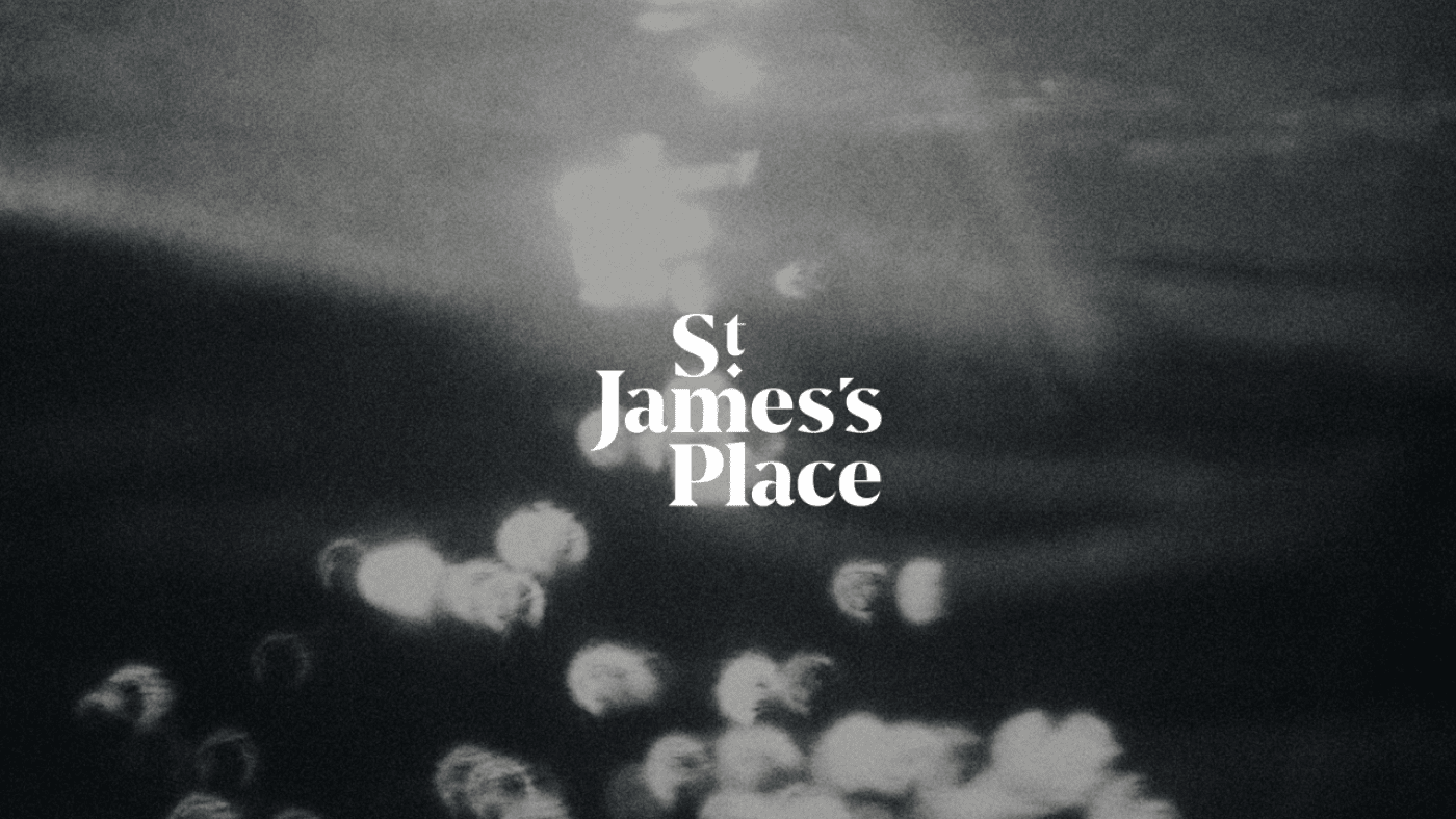 A black and white blurry background with the St James's Place in the centre in white tex.