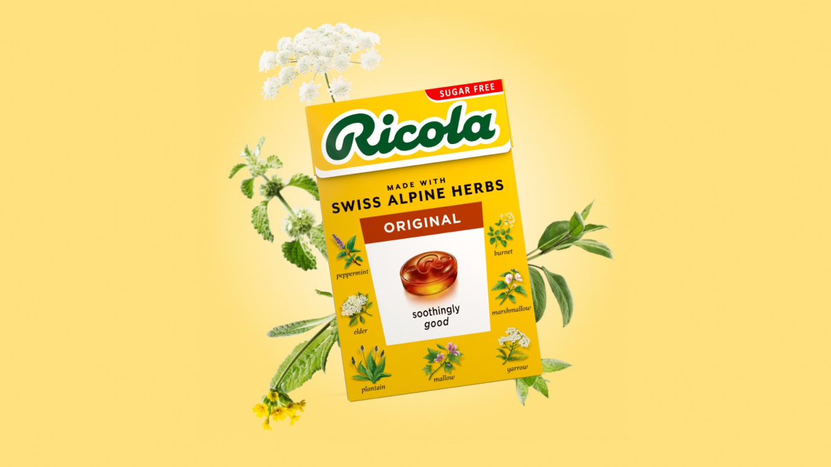 Pack of Ricola original drops with decorative herbs around the edge on a yellow background.