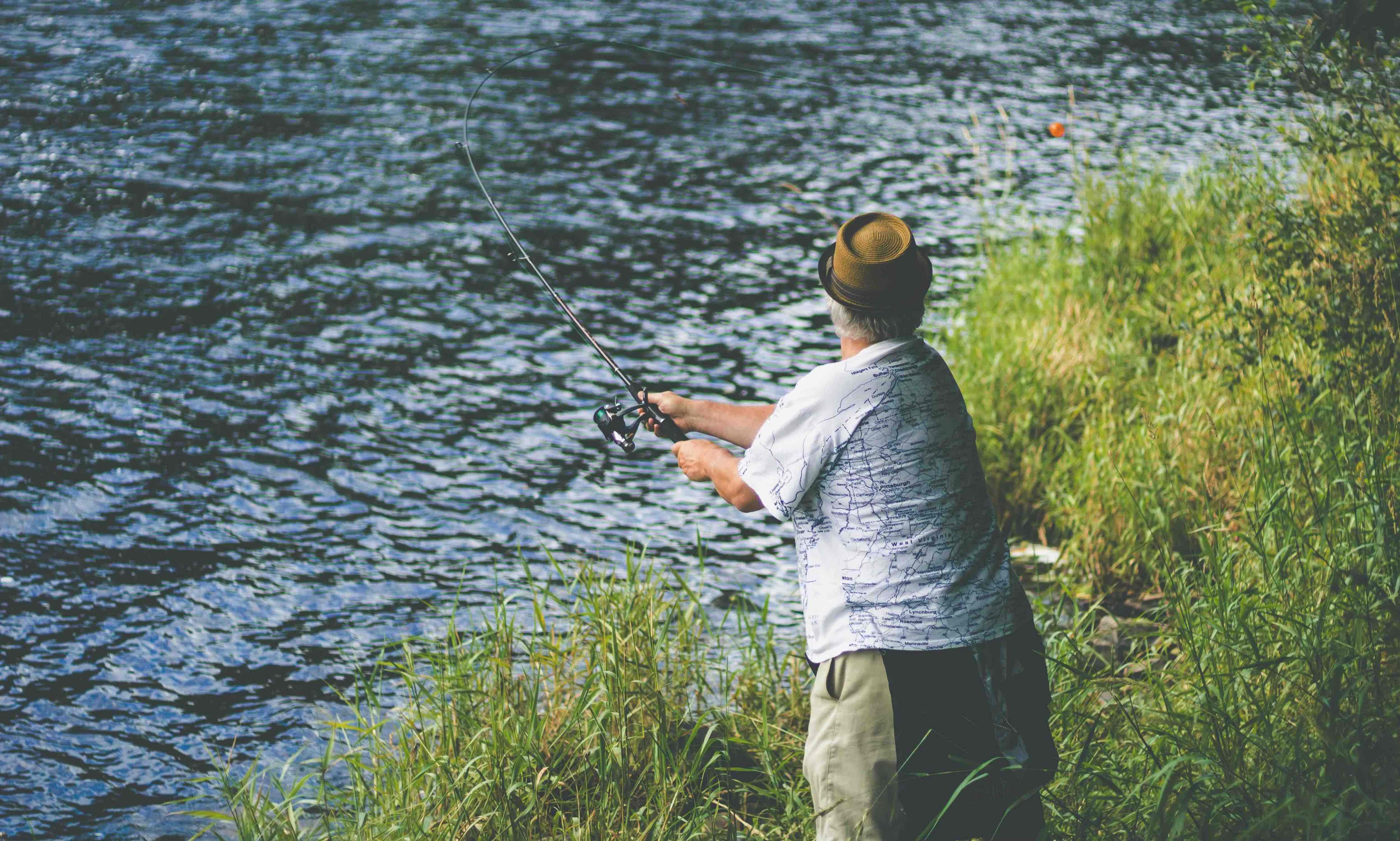 An Irishman fishing in a river.